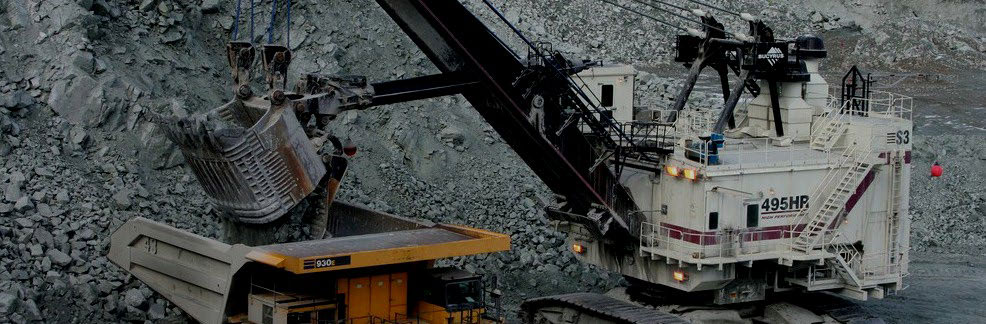 Material from the Gibraltar Mine is getting loaded onto machinery.